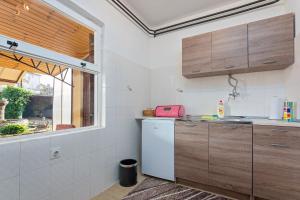 Kuchyň nebo kuchyňský kout v ubytování Apartments Pilicari