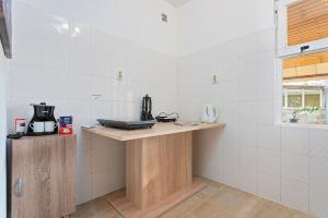 Kuchyň nebo kuchyňský kout v ubytování Apartments Pilicari