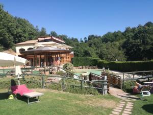 a house with a pool in a yard at Romantic loft in Pitigliano