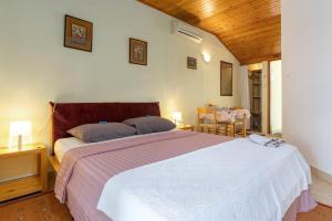 Postel nebo postele na pokoji v ubytování Apartments Pilicari