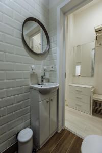 a bathroom with a sink and a mirror at Švitrigailos 7 in Vilnius