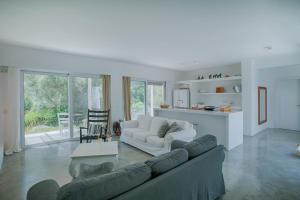 a living room with a couch and a table at Villa Mavrades in Sivota