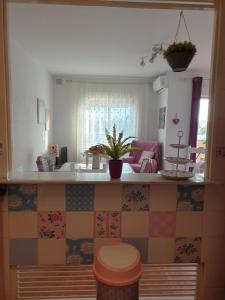 a kitchen with a sink and a counter top with tiles at Sol y Luz in Isla del Moral