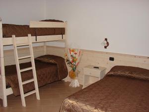 A bed or beds in a room at Bellaguarda ROOMS 10min da Tirano