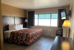 Ein Bett oder Betten in einem Zimmer der Unterkunft Sea Horse Inn and Cottages