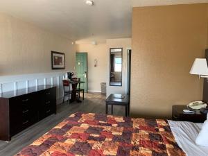 Ein Bett oder Betten in einem Zimmer der Unterkunft Sea Horse Inn and Cottages