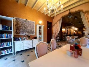 a library with a table and chairs and books at Eski Masal Hotel - Special Class in Antalya