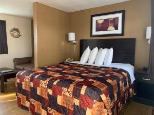 Ein Bett oder Betten in einem Zimmer der Unterkunft Sea Horse Inn and Cottages
