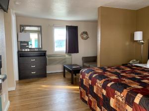 Ein Bett oder Betten in einem Zimmer der Unterkunft Sea Horse Inn and Cottages