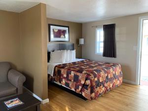 Ein Bett oder Betten in einem Zimmer der Unterkunft Sea Horse Inn and Cottages