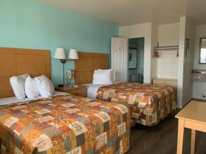 Ein Bett oder Betten in einem Zimmer der Unterkunft Sea Horse Inn and Cottages