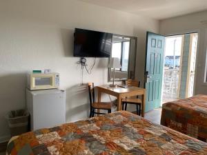 Ein Bett oder Betten in einem Zimmer der Unterkunft Sea Horse Inn and Cottages