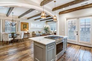 a kitchen with a stove and a living room at Sonoma Bungalows in Sonoma