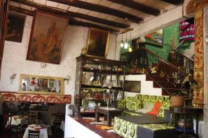 a room with a couch and a staircase in a room at Hotel Rural La Esperanza in Suesca