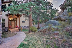a house with a walkway leading to the front door at Fall River Hideaway in Estes - 3 Mi to Natl Park! in Estes Park