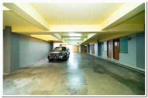 a car parked in the middle of an empty hallway at Koolkost Near Universitas Maranatha 2 Bandung - Minimum Stay 30 Nights in Bandung