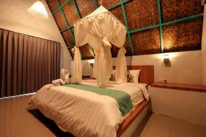 Postel nebo postele na pokoji v ubytování Makarma Resort Lombok + 37 fotografií