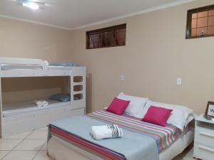 Cama ou camas em um quarto em Divino Lugar