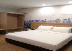 Postel nebo postele na pokoji v ubytování GiiA Sanno Hotel Pluit