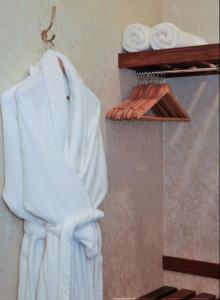 a white towel hanging on a wall in a bathroom at Olive Rabbit - Boutique Bed & Breakfast in Turangi