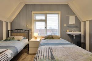 Ένα ή περισσότερα κρεβάτια σε δωμάτιο στο Ons Zeeuws Huus