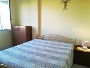 A bed or beds in a room at Near The Beach And The Center Of Otranto - Apartment Eleonora 5 Places