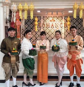 a group of people standing in front of a store at Romance Hotel Sukhumvit 97 in Bangkok +32 photos