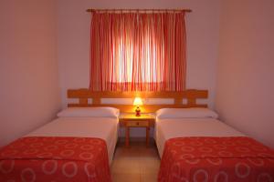 Postel nebo postele na pokoji v ubytování Apartamentos Escandell - Formentera Vacaciones