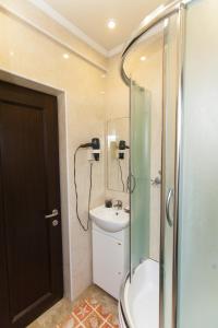 a bathroom with a shower and a sink at U Igorya Holiday Park in Alushta