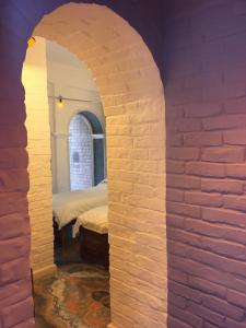 Postel nebo postele na pokoji v ubytování Rose Heritage Home