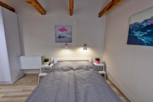 Posteľ alebo postele v izbe v ubytovaní Caesar Apartments & Rooms