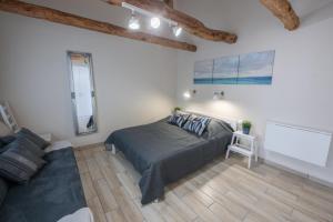 Posteľ alebo postele v izbe v ubytovaní Caesar Apartments & Rooms