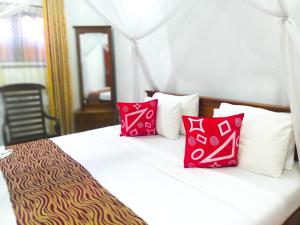 Postel nebo postele na pokoji v ubytování Sahana Sri Villa