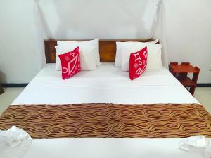 Postel nebo postele na pokoji v ubytování Sahana Sri Villa