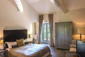 Postel nebo postele na pokoji v ubytování Château De Massillan