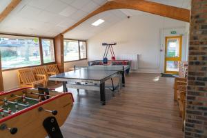 a ping pong room with a ping pong table at VVF Normandie Veules-les-Roses in Veules-les-Roses