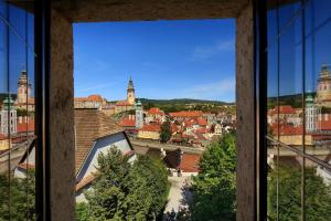 a view of a city from a window at Hotel Ruze in Český Krumlov