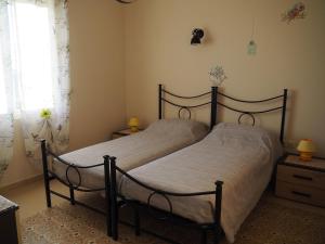 A bed or beds in a room at Villa Nefeli