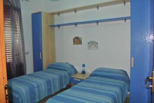Llit o llits en una habitació de Villetta a schiera Tety