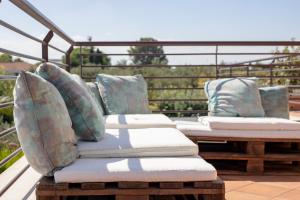 a row of pillows sitting on top of a balcony at B&B Valleluna in Trani