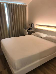 Toscana Charme Resort客房内的一张或多张床位