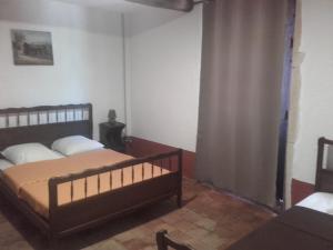 a bedroom with two beds and a window in it at domaine de crayeux in Les Champs