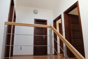 a pair of doors in a room with stairs at Private holiday house Vivendi in Liptovský Mikuláš