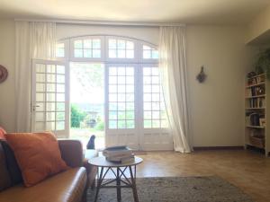 a living room with a couch and a table at Domaine Fontaine in Visan