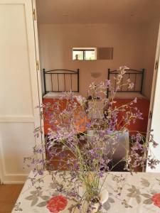 a vase filled with flowers sitting on a table at Apartamentos Mediterraneo in Marbella