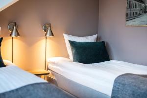 Postel nebo postele na pokoji v ubytování Hotel Sidesporet