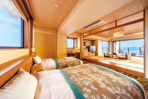 Voodi või voodid majutusasutuse Ryugujo Spa Hotel Mikazuki Fujimitei toas