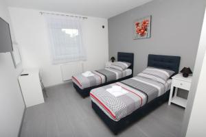 Postel nebo postele na pokoji v ubytování Apartment Karlo 1