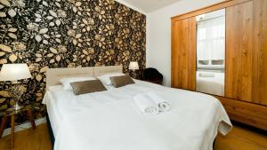 Posteľ alebo postele v izbe v ubytovaní Apartamenty EverySky - Górna 8