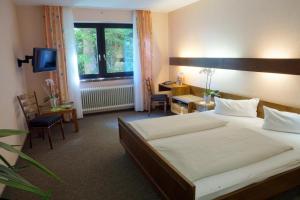 Posteľ alebo postele v izbe v ubytovaní Hotel Zur Heide